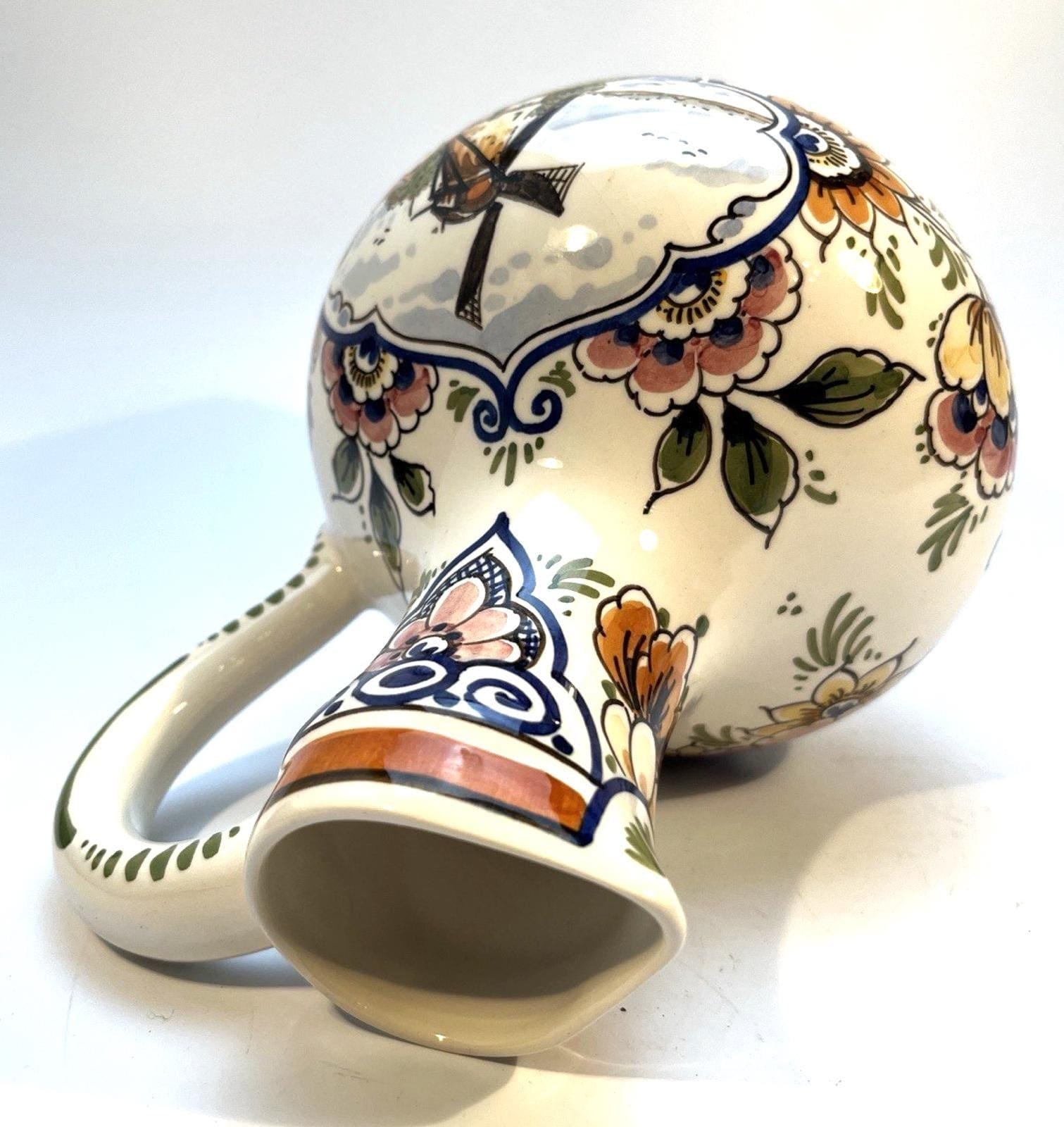 Vintage delft pottery jug in colourful hand painted windmill art and folk art