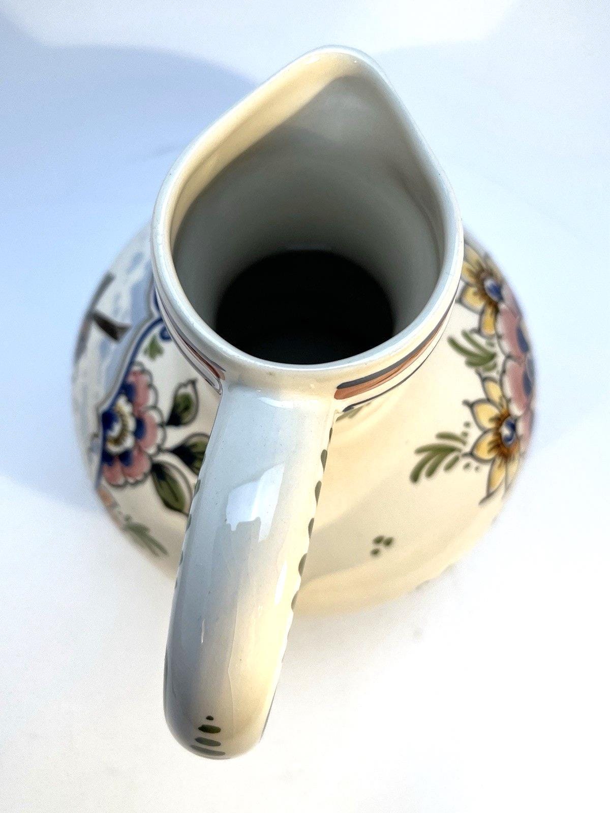Vintage delft pottery jug in colourful hand painted windmill art and folk art