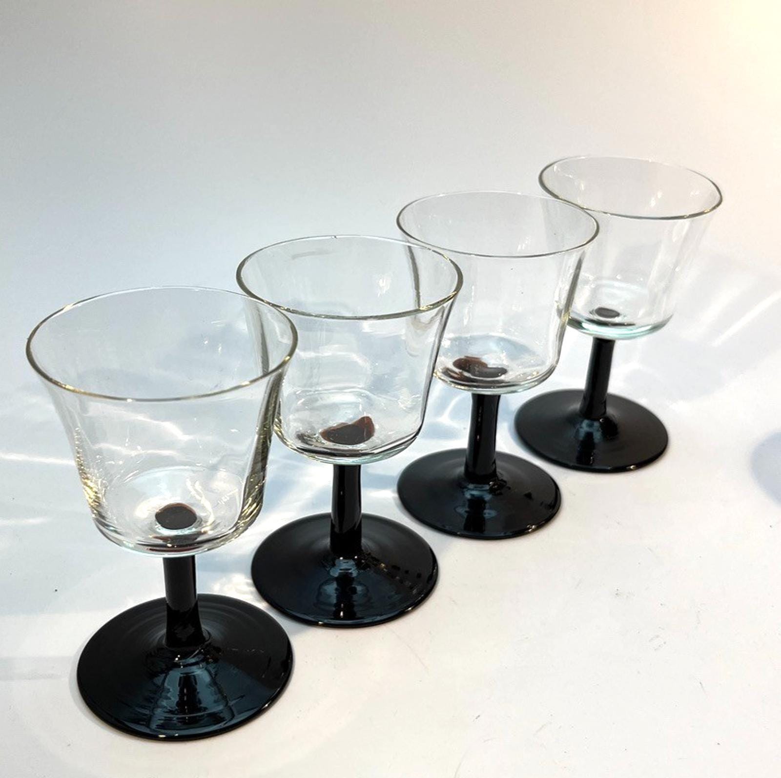 Set of 4 Vintage Stemmed Glasses. Liquor Glasses with Black Glass Stems