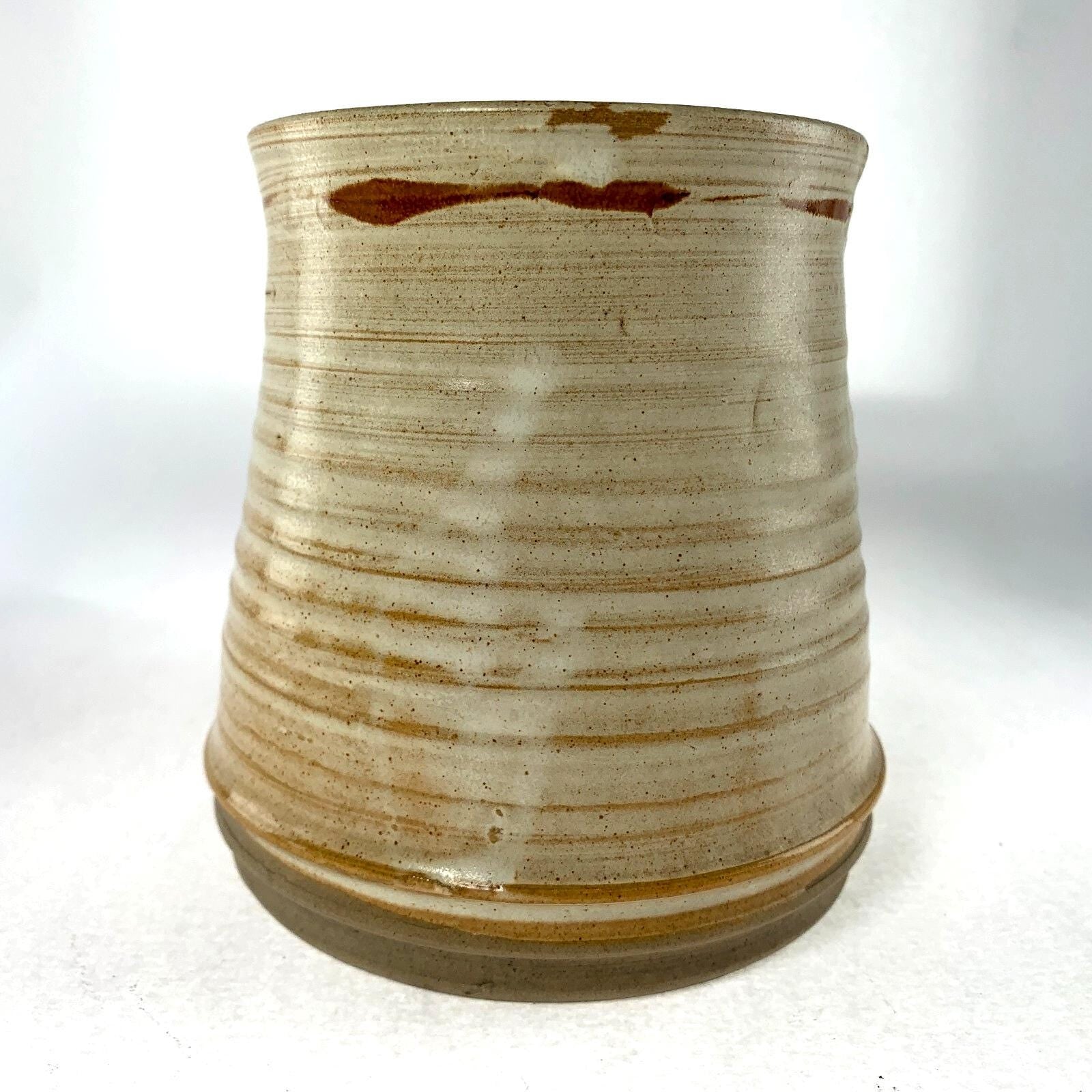 Mid century studio pottery vase with hand painted floral decoration on beige