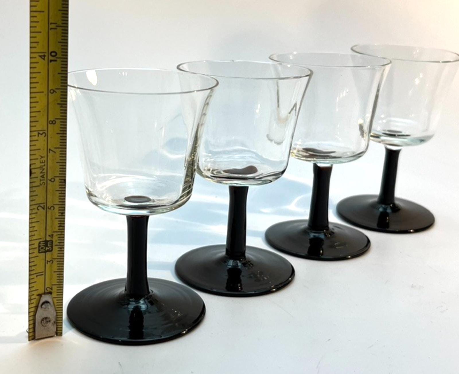Set of 4 Vintage Stemmed Glasses. Liquor Glasses with Black Glass Stems