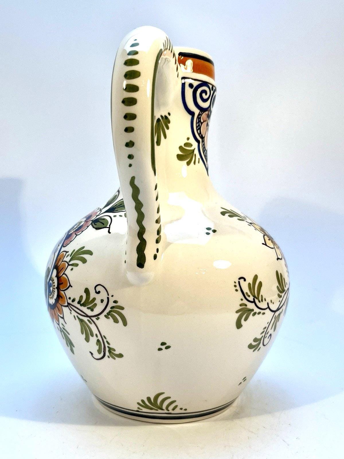 Vintage delft pottery jug in colourful hand painted windmill art and folk art