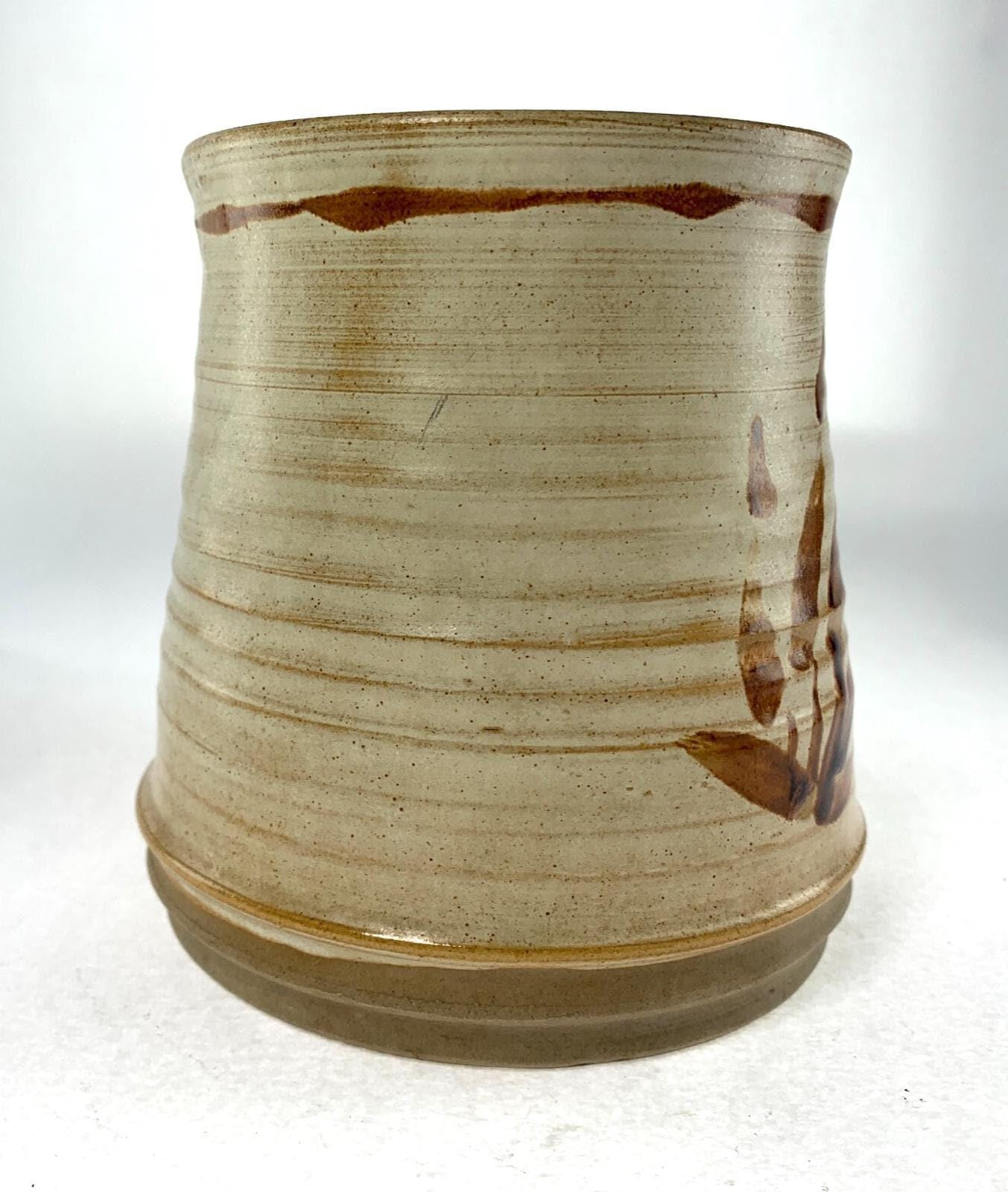 Mid century studio pottery vase with hand painted floral decoration on beige