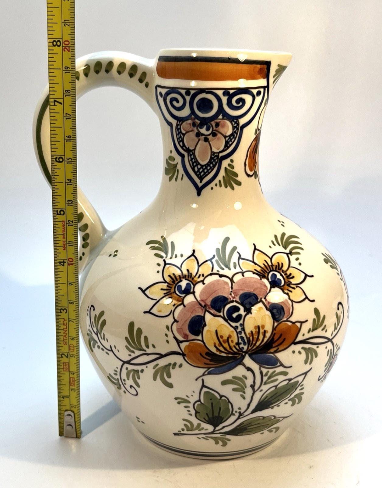 Vintage delft pottery jug in colourful hand painted windmill art and folk art