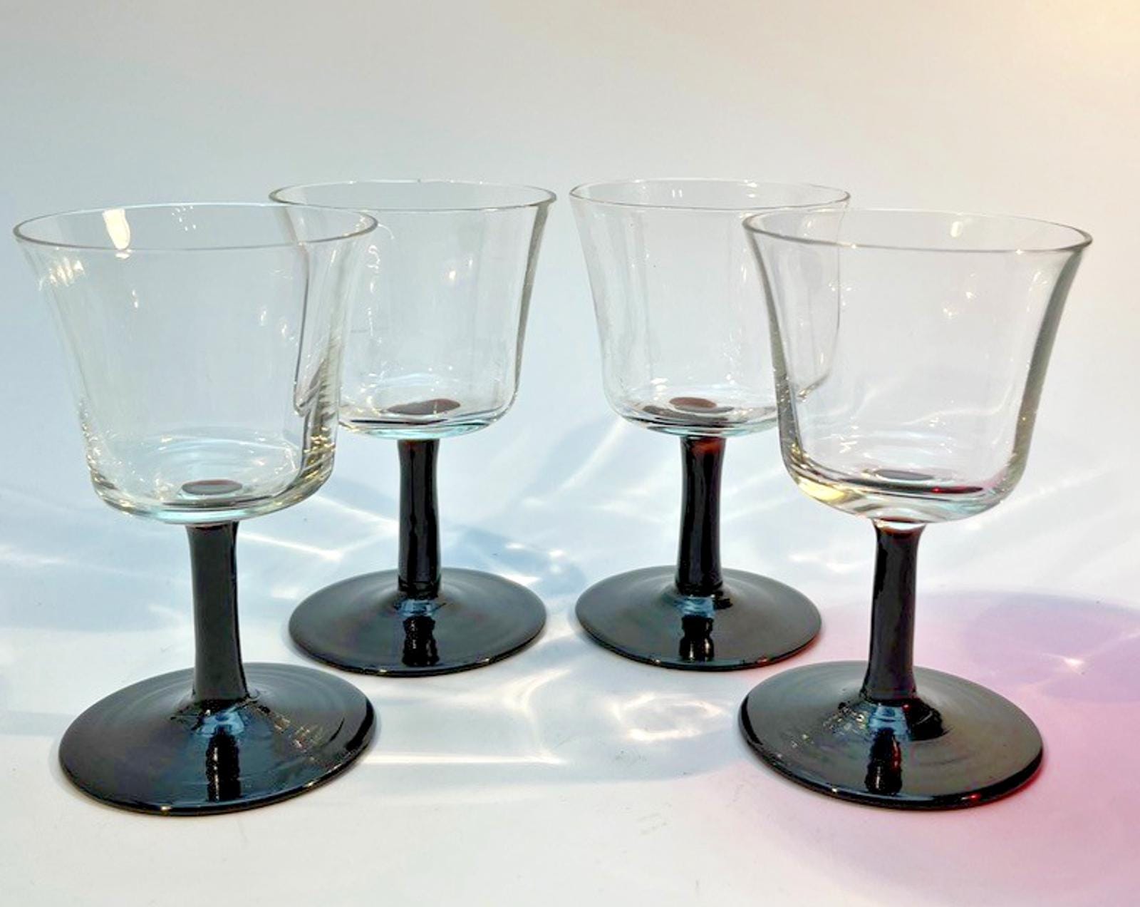Set of 4 Vintage Stemmed Glasses. Liquor Glasses with Black Glass Stems