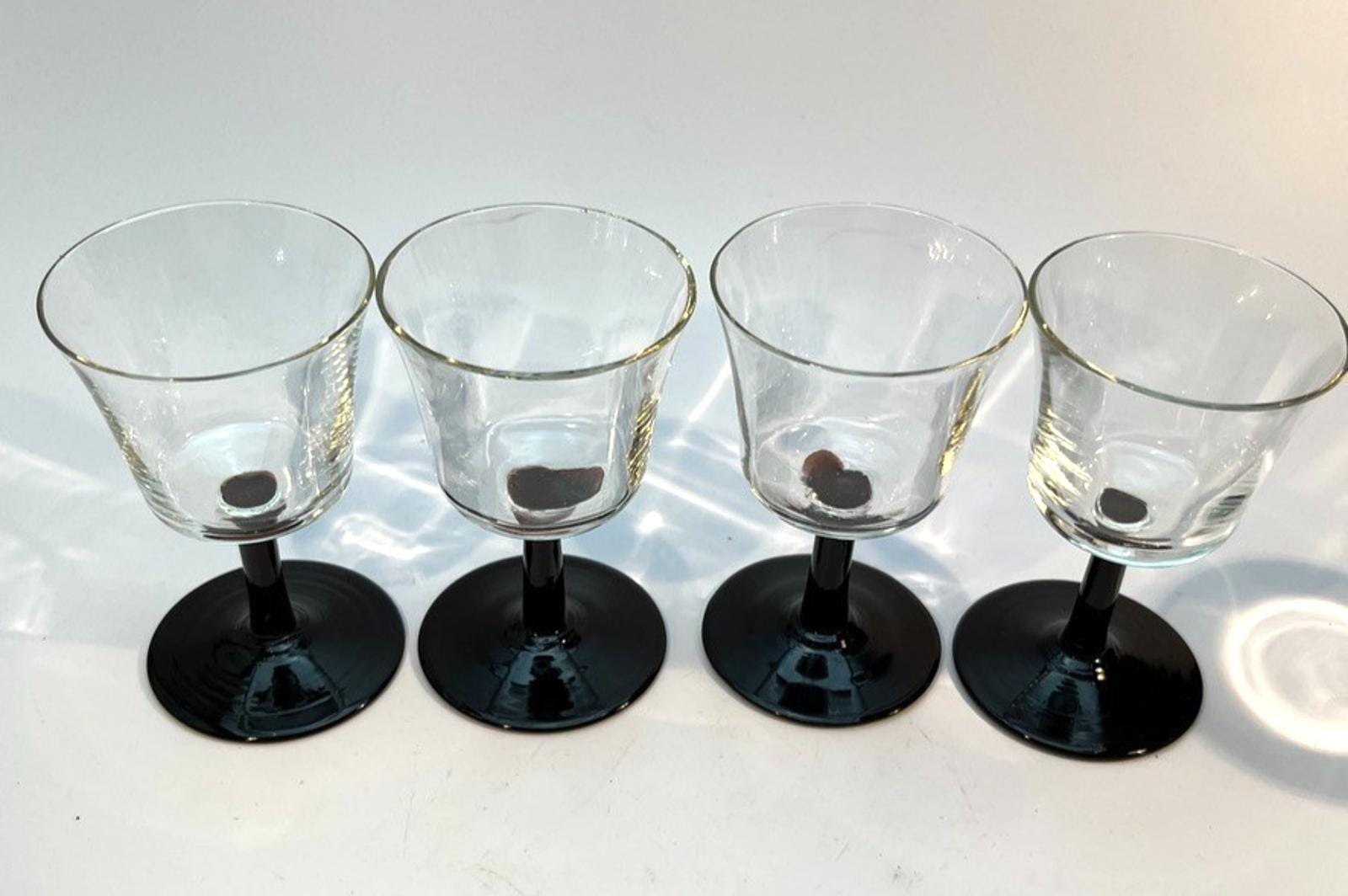 Set of 4 Vintage Stemmed Glasses. Liquor Glasses with Black Glass Stems