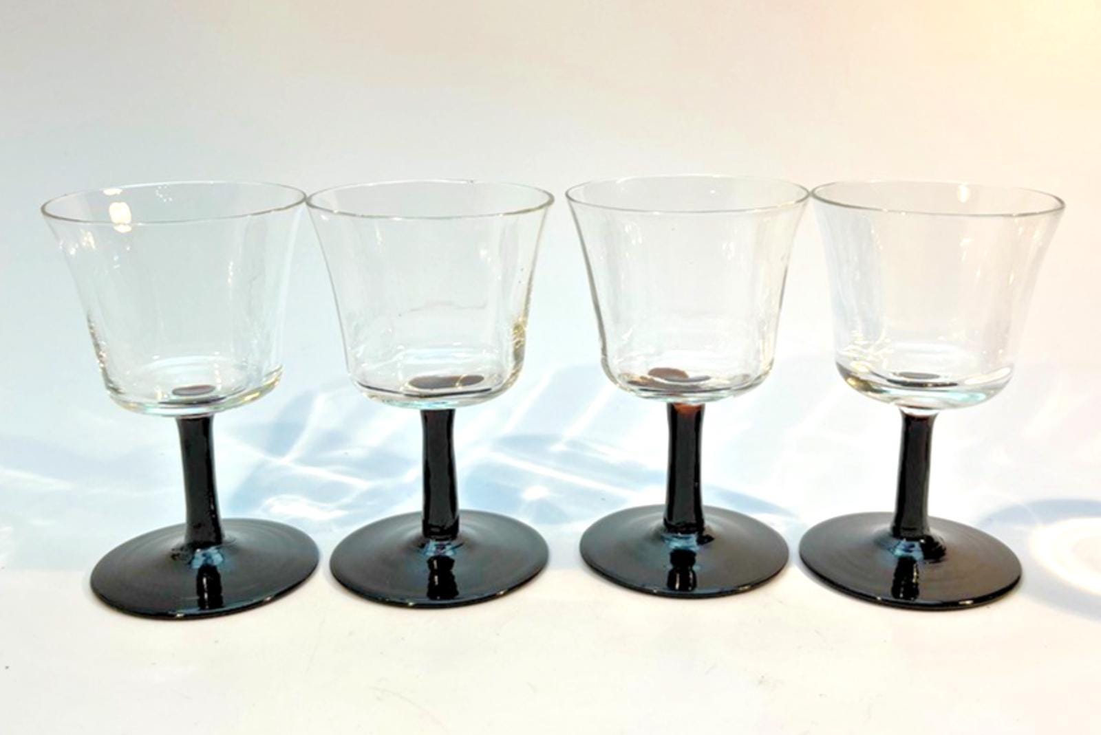 Set of 4 Vintage Stemmed Glasses. Liquor Glasses with Black Glass Stems