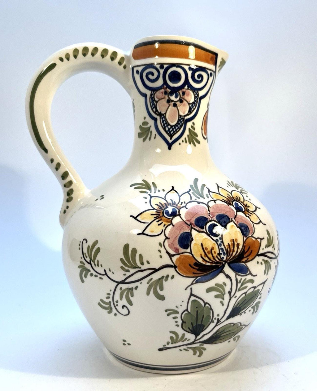 Vintage delft pottery jug in colourful hand painted windmill art and folk art